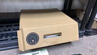 Cardboard box with iRobot logo and open flap