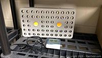 Front view of Phlizon PHBL2 LED grow light panel with attached power cord and temperature/humidity monitor device