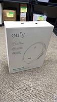 Sealed white Eufy RoboVac 11S retail box standing upright