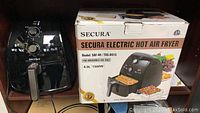 Secura Electric Hot Air Fryer with packaging showing model SAF-40 TXG-DS15, 4.0L, 1500W, and product image.