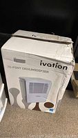 Cardboard retail box labelled Ivation 70-Pint Dehumidifier