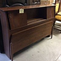 Mid-century style wooden double bed headboard and footboard, showing open shelf detail and solid footboard panel.