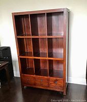 Front view showing nine cubbies and three drawers