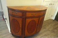 Front view of closed curved sideboard