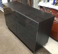 Full front view of dark grey woodgrain two-door cabinet