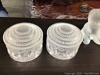 Pair of frosted glass candy dishes with lids shown from top/side