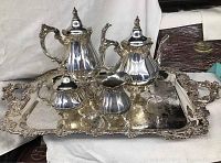 Full set of tea service displayed on an ornate silver tray