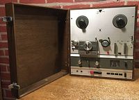 Overall view of recorder inside its wood case with lid open