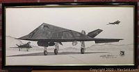 Framed black and white print of F-117A Stealth Fighter with two other aircraft in the background.