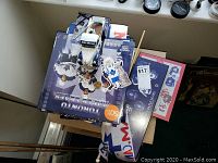 Overview photo showing Toronto Maple Leafs calendars and memorabilia items on a table with windowsill.