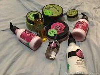 Photo of all products in lot arranged together, including British Rose and Olive lines with price stickers on some items.