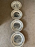 Set of four vertically arranged collector plates on floor.