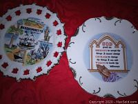 Two antique hanging plates showing full designs on both plates with red background.