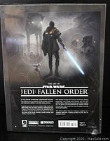 Back cover of the book featuring the title and description about the book contents, mentioning it is an oversized hardcover showing development of the recent console and interactive additions to Star Wars, with high detail and quality presentation