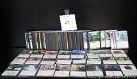Overview of over 300 Magic: The Gathering cards boxed and partially spread out, showing the quantity and general look