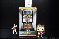 Full lot of Wonder Woman figures including the boxed limited edition pewter figurine and two vintage action figures.