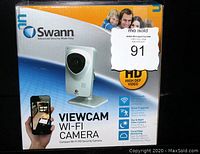 Front of original box showing product name, brand, and key features including HD video, Wi-Fi ready, event triggered recording, day & night vision, and cloud monitoring.