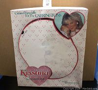 Original box of Krystina Dynasty doll showing front with heart shaped window and portrait image of character from TV show.