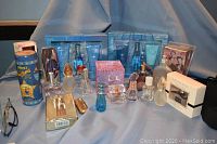 Overall view of fragrance lot showing gift sets, boxed fragrances, and loose bottles on display