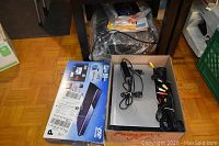 Boxed Panasonic Blu-ray player with power and AV cables in a cardboard box