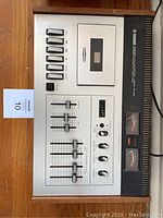 Front view of Yamaha TB-700 cassette tape deck showing buttons, sliders, and VU meters