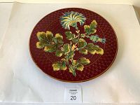 Full view of the vintage majolica wall platter showing overall design and color.