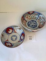 Photo of both bowls showing their upper designs and size difference.