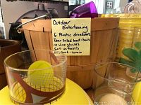 Photo showing the handwritten note describing the contents of the outdoor entertaining lot including drinkware and utensils