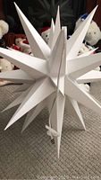 22-inch white star holiday hanging decoration with cord and bulb