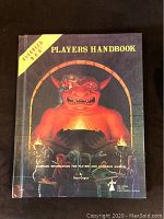 Cover of the book displaying the 1978 Advanced Dungeons & Dragons Players Handbook with wear visible on edges and corners.