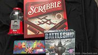 Overview of lot with Scrabble, Battleship, bubblegum machine and Rainbow Loom