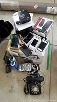 Overview of all items including phones, case, speakers, PVR and rotary phone