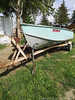 Side view of boat mounted on trailer
