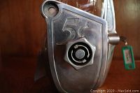 Front close-up showing 5¢ embossing on coin slot and adjustment knob