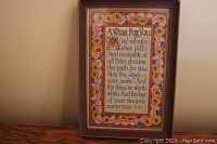 Full view of framed print, showing floral border and text