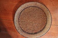 Top-down image showing the round serving tray with metal lattice and yellow glass beads inset.