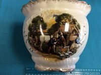 White ceramic planter side with painted countryside scene including horses and man, showing detail and size