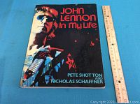 Front cover of the book 'John Lennon In My Life' showing photo of John Lennon, title, and authors.