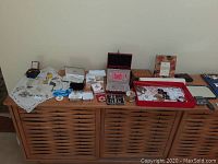 Full view of all jewelry and jewelry boxes on table showing assortment of pieces and storage boxes