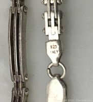 Close-up photo of the necklace clasp stamped '925 ITALY' showing the silver purity mark and origin.
