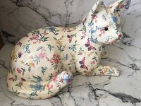Full side view of the paper mache cat showing detailed floral and butterfly painting.