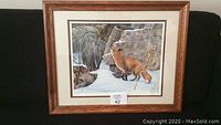 Framed print showing a red fox in a detailed natural setting with snow and rocks.