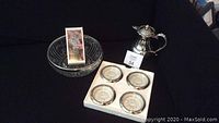 Photo showing vintage Birks silver hinged teapot, set of four silver and crystal coasters in white box, and a large cut-glass crystal bowl.