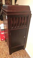 Closed mahogany phonograph cabinet exterior