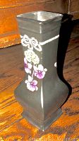 Single black Shelley vase with hand-painted floral designs