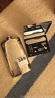 Flask and open grooming kit displayed together