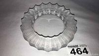 Top-down view of clear crystal dish showing fern leaf pattern and scalloped rim