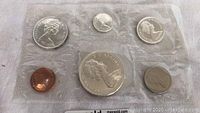 Full set of five Canadian coins in original cellophane packaging.