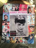Front cover of the hardcover book showing Audrey Hepburn and a collage of international magazine covers.