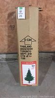 Box packaging of the 4.5 ft Douglas Fir artificial Christmas tree showing key brand and product details.